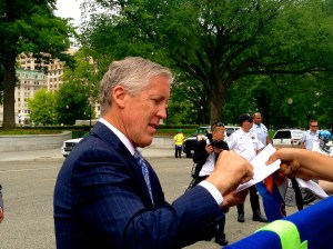 Coach Pete Carroll giving the crowd some love