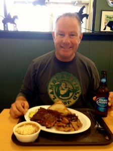 Happy with his Oklahoma Joe BBQ!