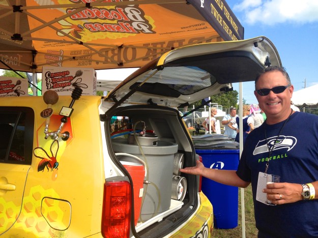 Taps right on the side of the car